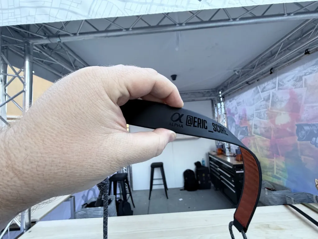 Personalized strap displayed beside event engraving equipment